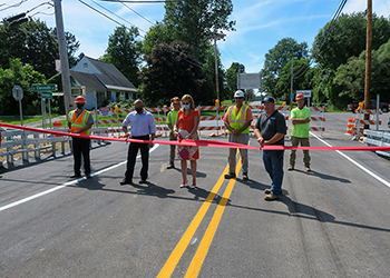 mayor cutting ribbon on new bridge