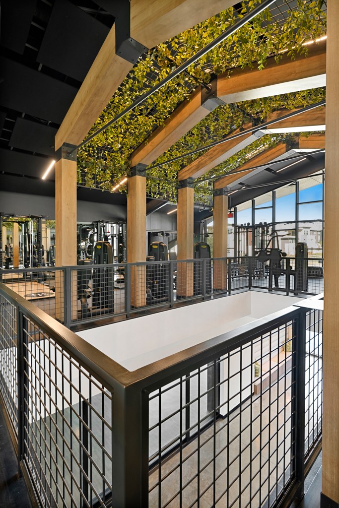 Wood architectural trellis in the interior of the building, a customized component of the pre-engineered metal building